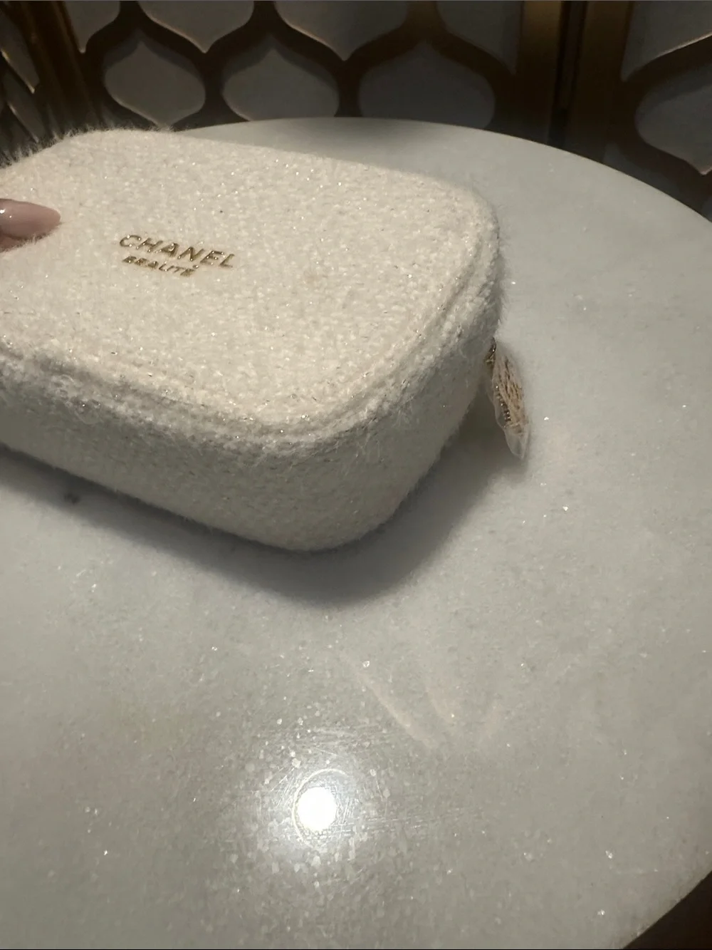CHANEL cream boucle cosmetic pouch with gold logo